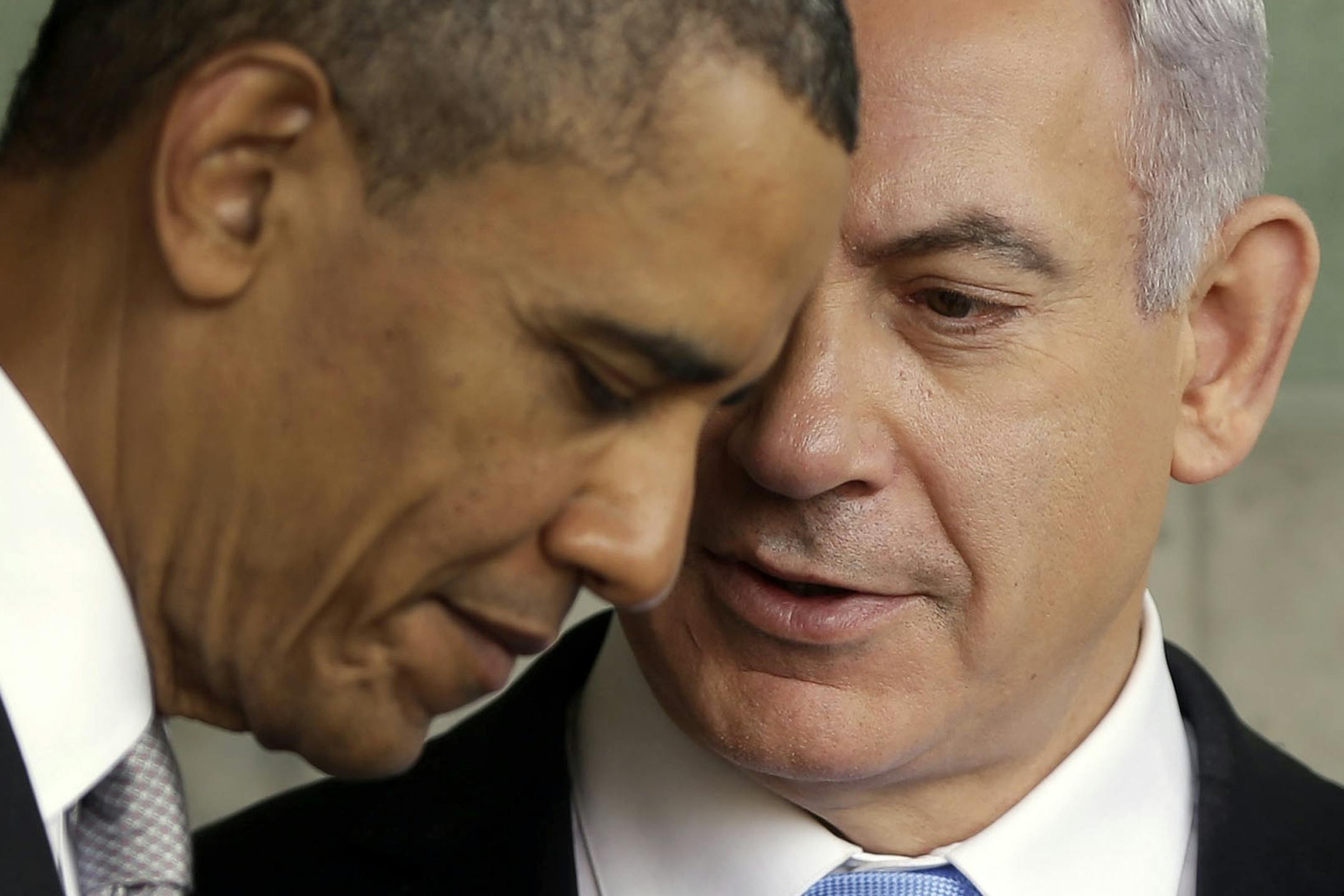 President Barack Obama, left, listens to Israeli Prime Minister Benjamin Netanyahu during their visit to the Children's Memorial at the Yad Vashem Holocaust memorial in Jerusalem, Israel, Friday, March 22, 2013.