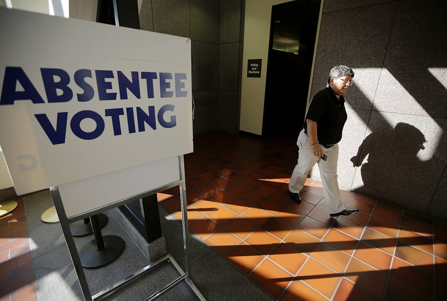 "I love to vote," said Darla Kashian after she voted at the absentee-voting polls at the Hennepin County Government Center, Thursday, October 23, 2014 in Minneapolis, MN. ] (ELIZABETH FLORES/STAR TRIBUNE) ELIZABETH FLORES &#x2022; eflores@startribune.com