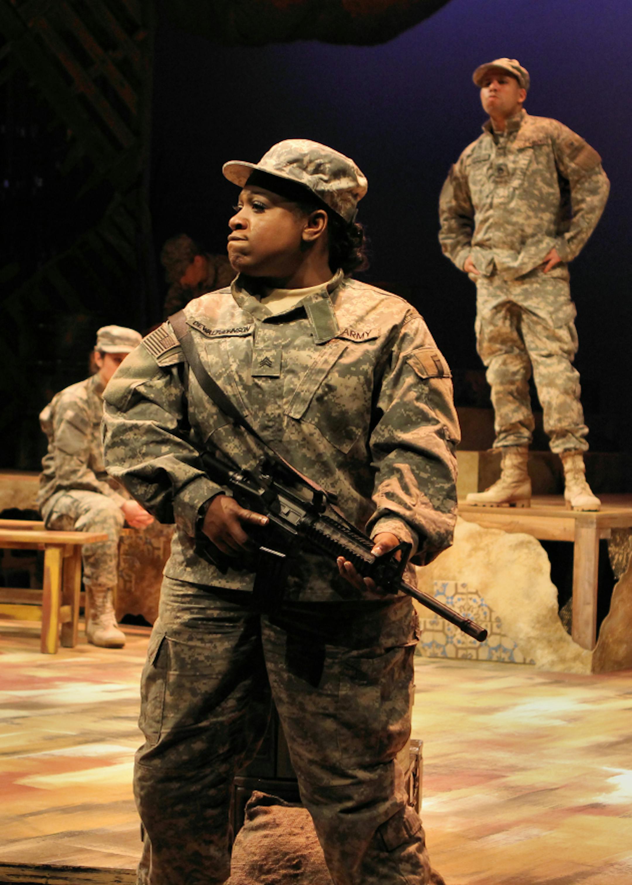 Soldier Terris Dewalt-Johnson (Jamecia Bennett) stands up to a superior officer (Santino Craven) in "Lonely Soldiers: Women at War in Iraq" at History Theatre. Photo by Scott Pakudaitis. March 16-April 6, 2014