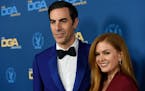 Sacha Baron Cohen, left, and Isla Fisher arrive at the 71st annual DGA Awards at the Ray Dolby Ballroom on Saturday, Feb. 2, 2019, in Los Angeles. Coh