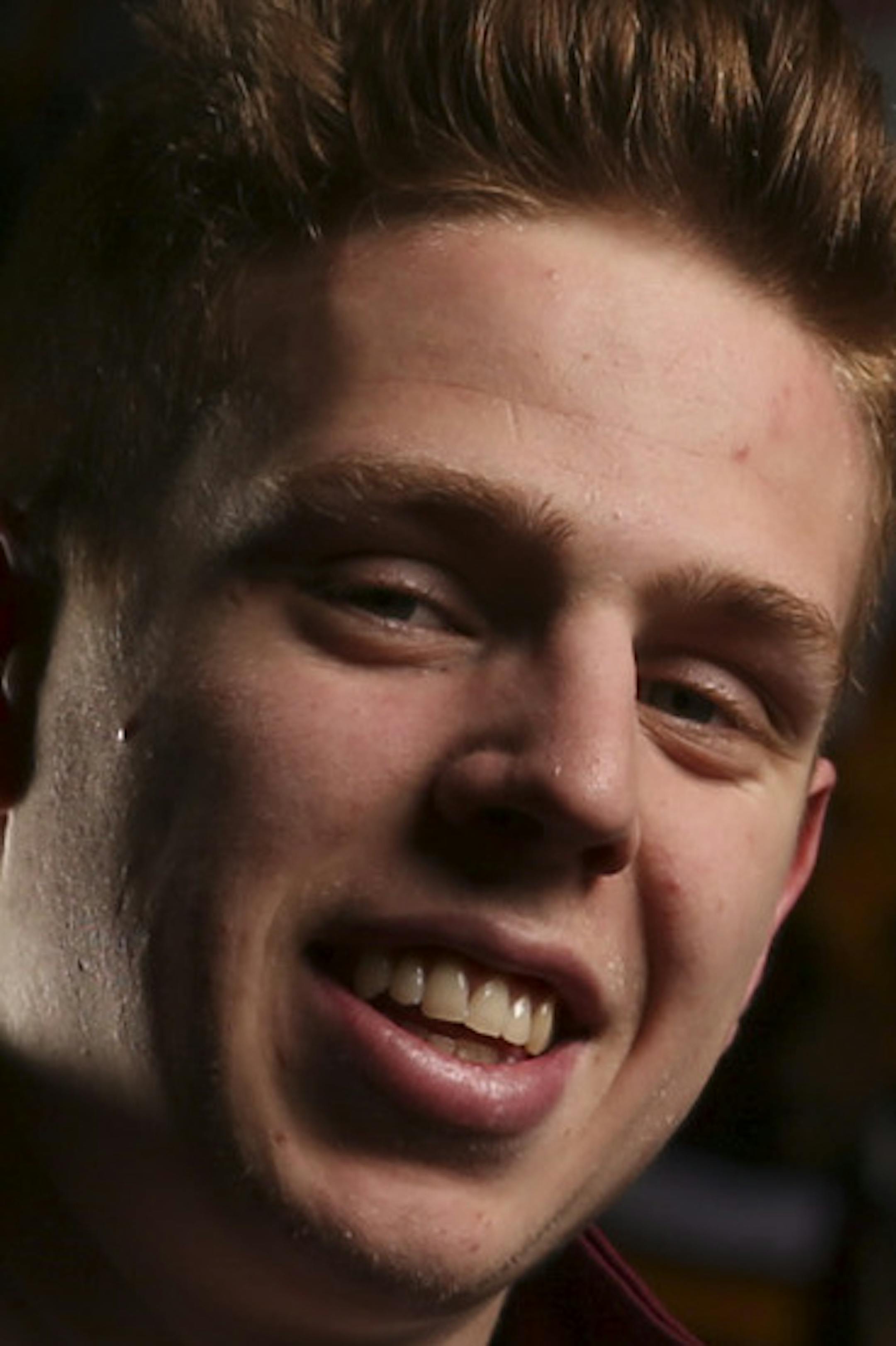 Gophers' junior defenseman Mike Reilly with the mural at Mariucci Arena where his image was added to the previous hockey All-America selections. ] JEFF WHEELER &#xef; jeff.wheeler@startribune.com The Gophers' junior defenseman Mike Reilly is first team All-America and two-time Big Ten Defensive Player of the Year, photographed in front of the mural he's in at Mariucci Arena Wednesday afternoon, March 25, 2015. ORG XMIT: MIN1503251646314204