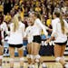 University of Minnesota celebrate their 3 sets to 0 victory over the University of North Dakota in the first round of the NCAA volleyball tournament a