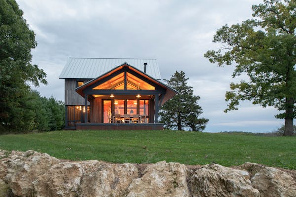 Wisconsin country retreat is 'rough and rustic' outside, warm and modern inside
