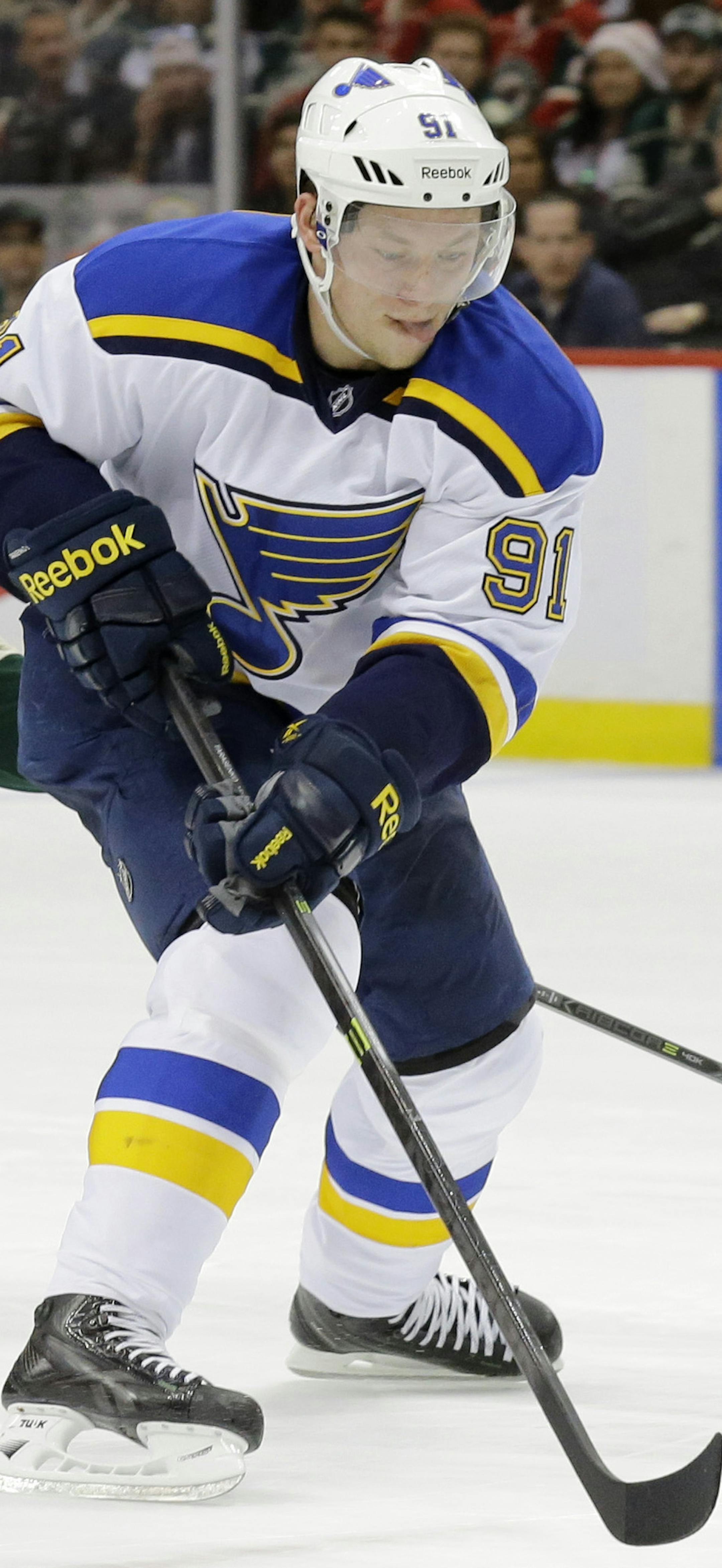 St. Louis Blues right wing Vladimir Tarasenko (91), of Russia, controls the puck in front of Minnesota Wild defenseman Matt Dumba (55) during the second period of Game 4 of an NHL hockey first-round playoff series game in St. Paul, Minn., Wednesday, April 22, 2015. (AP Photo/Ann Heisenfelt)