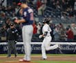 Yankees designated hitter Giancarlo Stanton, right, jogged around the bases past Twins starter Jake Odorizzi after hitting a solo home run during the 