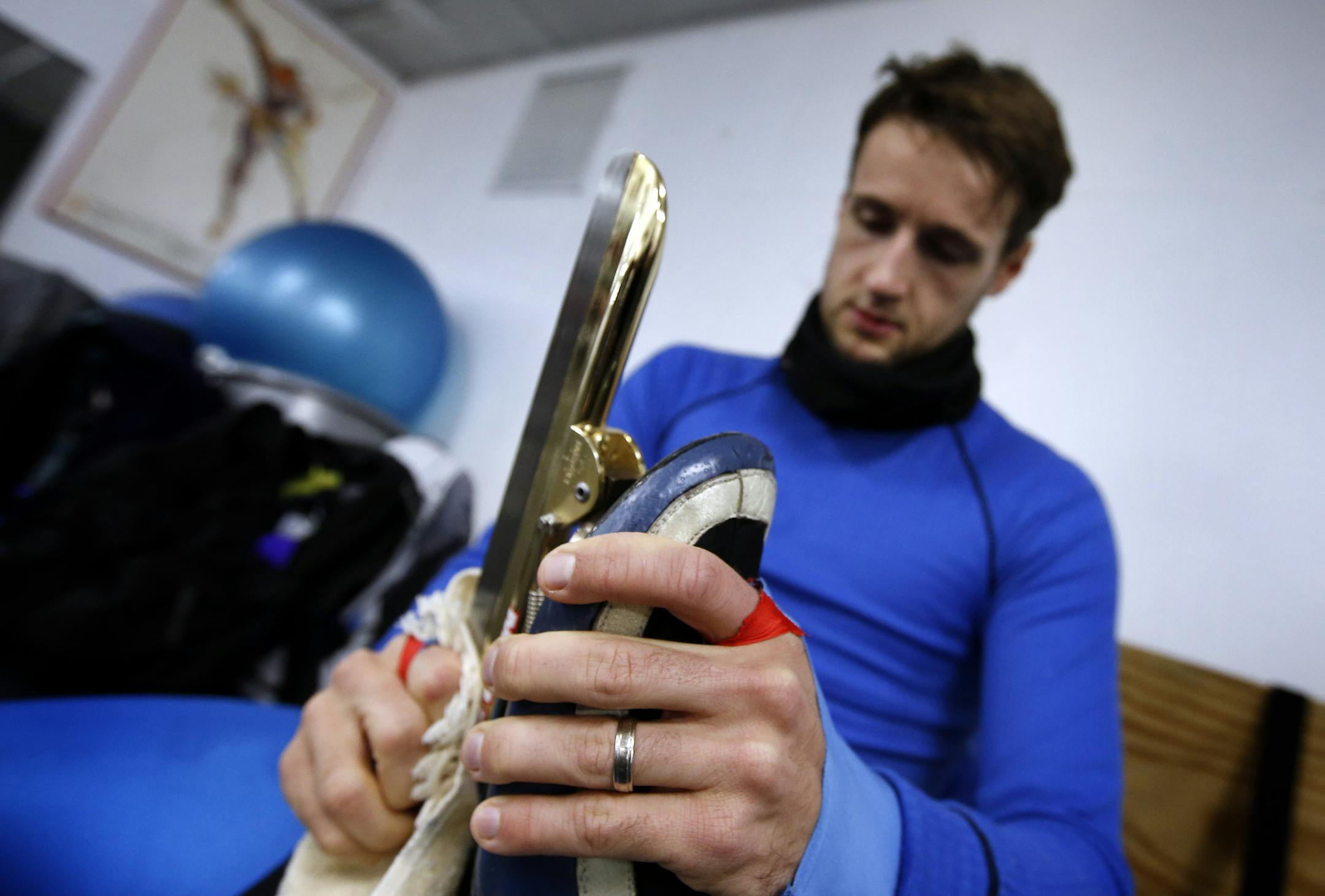 Paul Dyrud cleaned his skates after a training session at the John Rose Oval in Roseville on Tuesday. Dyrud is an Olympic speed skating hopeful. ] CARLOS GONZALEZ cgonzalez@startribune.com - December 3, 2013, Roseville, Minn., John Rose Oval, Olympics Hopeful speed skater Paul Dyrud ORG XMIT: MIN1312041729210933
