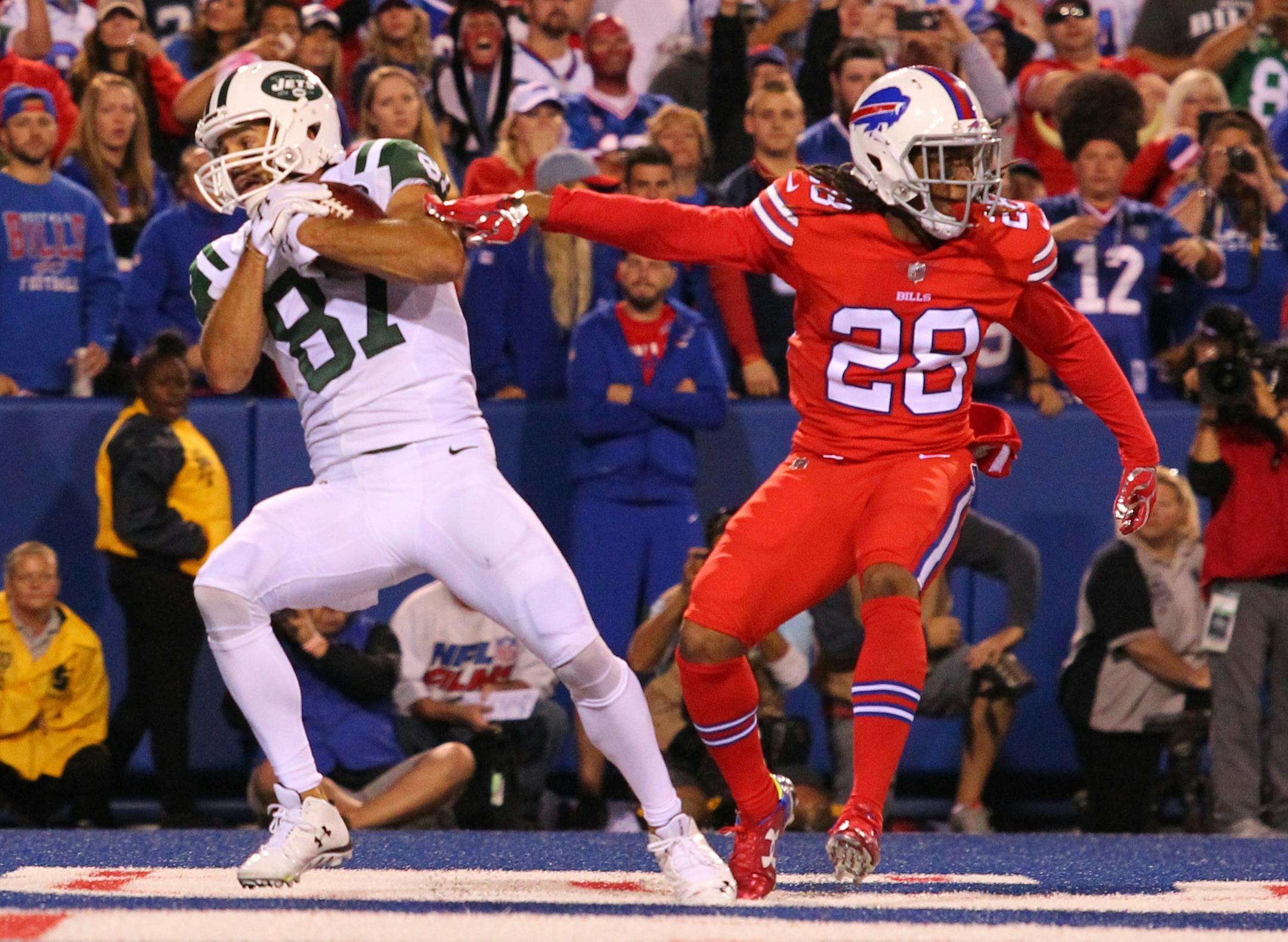New York Jets wide receiver Eric Decker (87) catches a touchdown reception in front of Buffalo Bills cornerback Ronald Darby (28) during the first half an NFL football game on Thursday, Sept. 15, 2016, in Orchard Park, N.Y. (AP Photo/Bill Wippert)