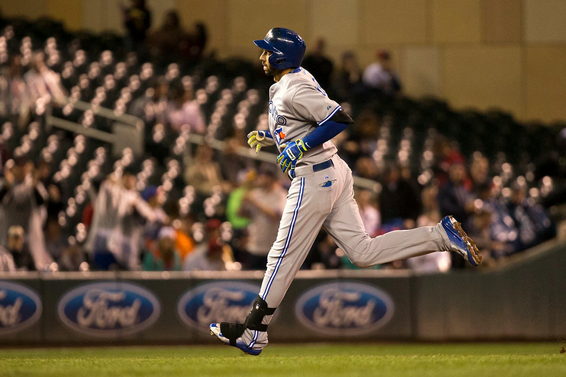 Toronto Blue Jays right fielder Chris Colabello (15) rounded the bases after hitting a 2-run homer in the top of the ninth against the Minnesota Twins Friday night.
