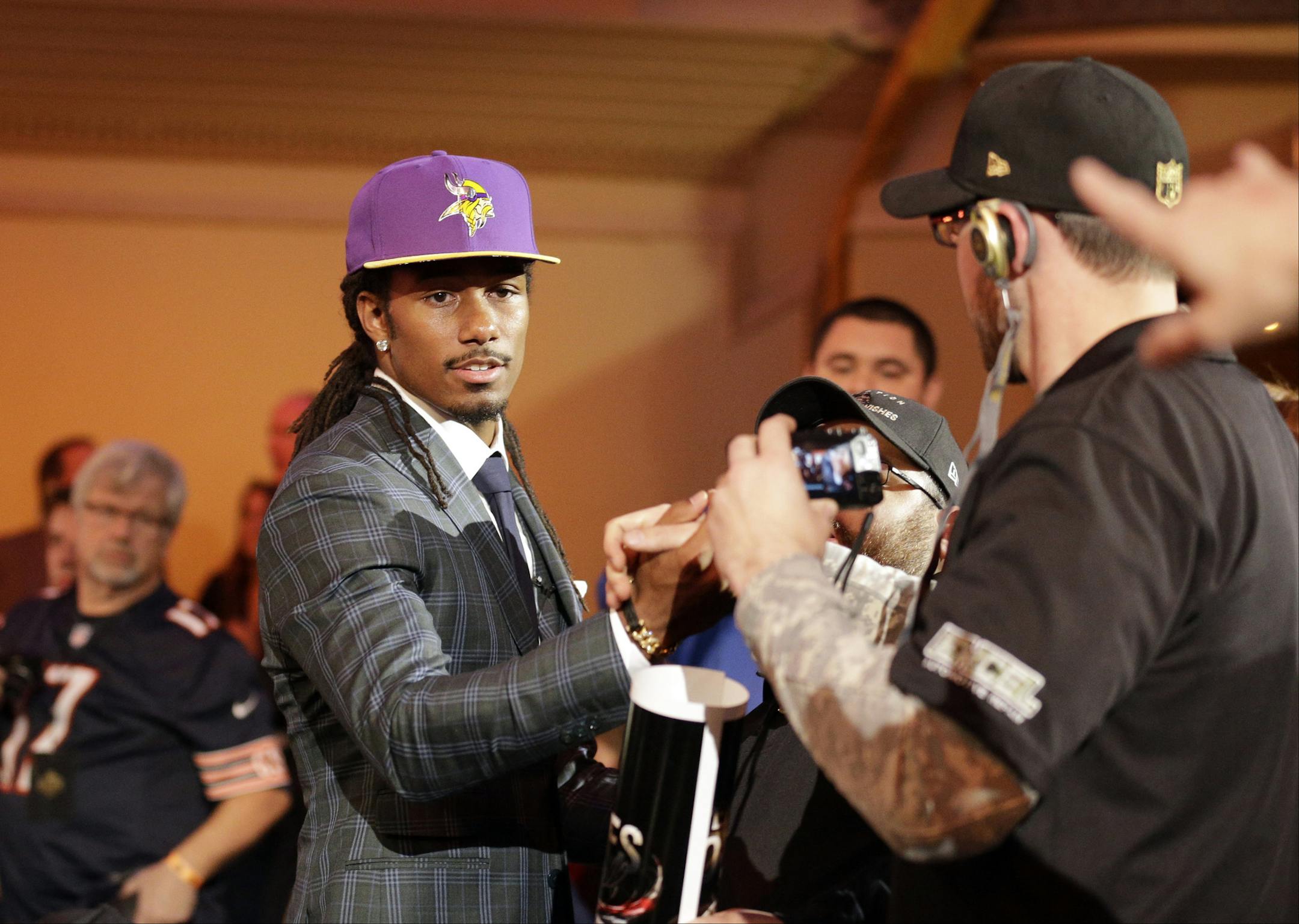 Michigan State defensive back Trae Waynes celebrates with fans after being selected by the Minnesota Vikings as the 11th pick in the first round of the 2015 NFL Football Draft,