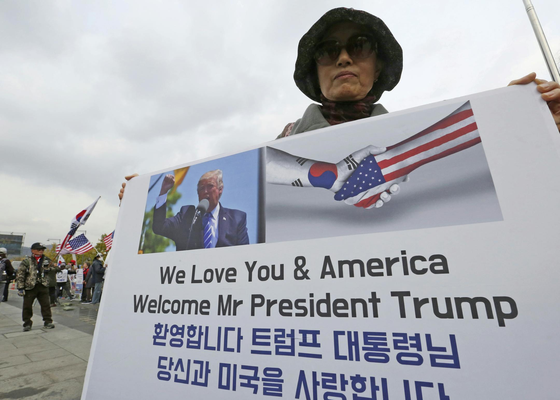 In this Wednesday, Nov. 1, 2017, photo, a South Korean protester against North Korea stands to welcome a planned visit by the U.S. President U.S. President Donald Trump near the U.S. Embassy in Seoul, South Korea. During his first months as president, Trump, who will visit Japan, South Korea and China before attending regional summits in Vietnam and the Philippines, has blended moments of flattery with vows to rip up trade deals, destroy a sovereign nation with nuclear weapons and generally cras