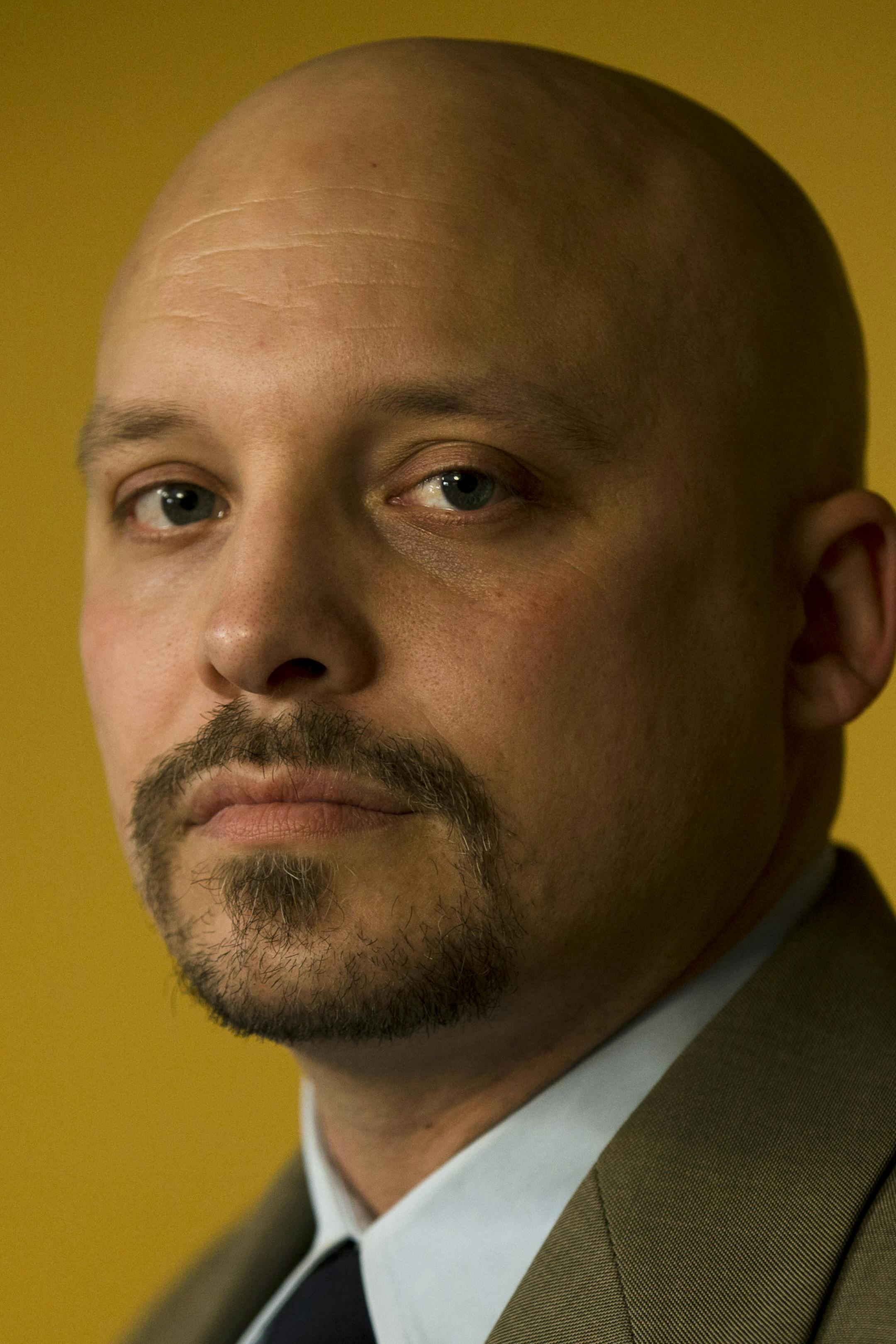 Former Marine Corps scout sniper Earl J. Catagnus Jr., stands for a photograph at his home in Eagleville, Pa. on Wednesday, Jan. 8, 2014. "If you watch 'NCIS' or anything that has a Marine ... they always say, 'Oh, I was in Fallujah,'" says the Purple Heart recipient, who left the military as a staff sergeant in 2006 and is now an assistant professor of history at Valley Forge Military Academy & College in Wayne, Pa. "For the new generation, it's because everybody keeps mentioning it. And that i