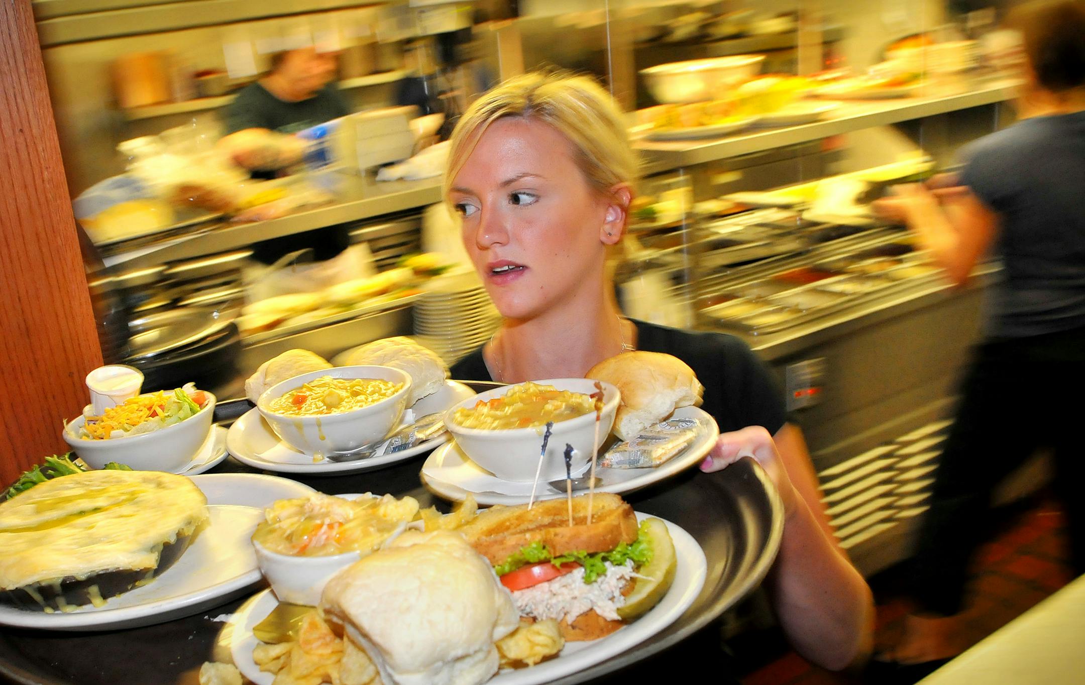 During a busy lunch hour Wednesday, Melissa Schweizer brought meals to customers at Patrick McGovern's Pub on W. 7th Street, one block from the Xcel Energy Center. The pub will be closed to the public Sunday through Thursday because of activities related to the Republican National Convention.