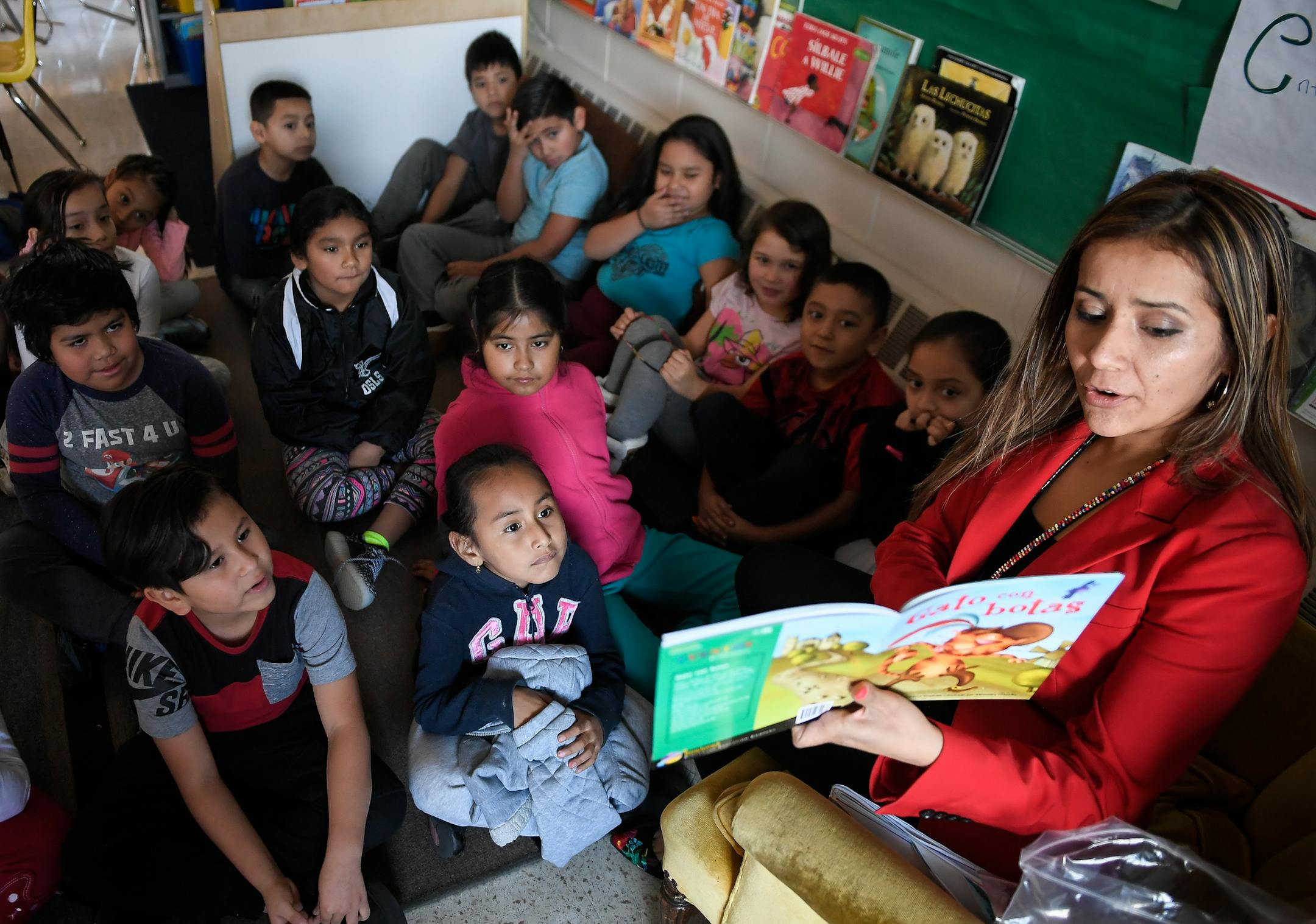 Elizabeth Ledesma read "Puss in Boots" in Spanish to second-graders at in her dual-language class at Green Central Park Elementary.