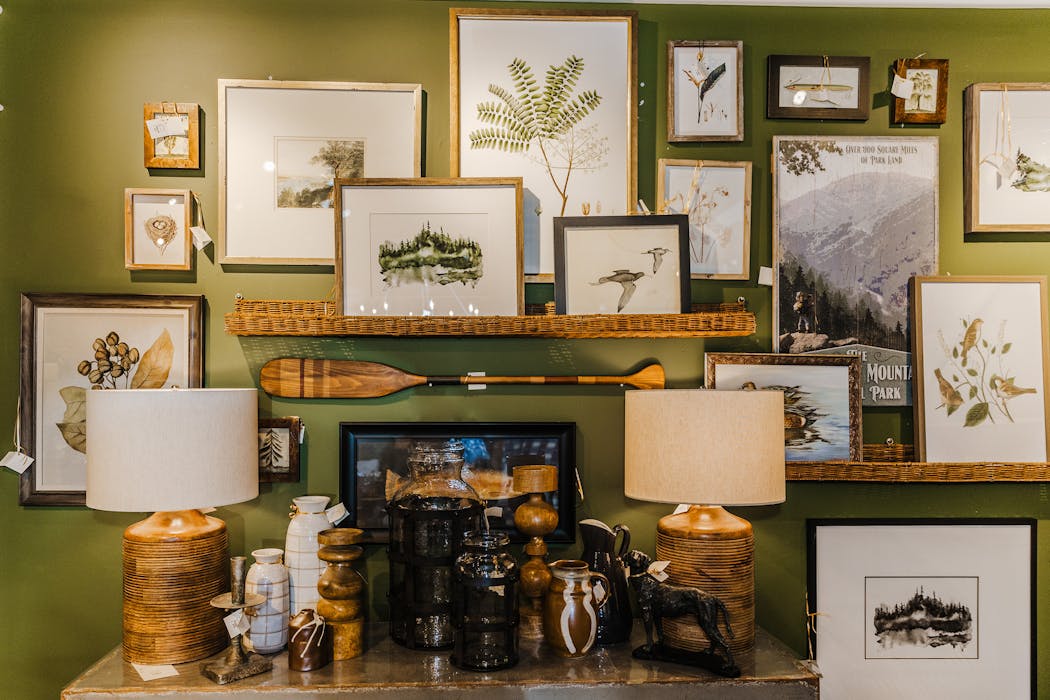 Think outside the frame — fish plates, oars and perhaps even mounted fish can make for an interesting and exciting gallery wall addition. 