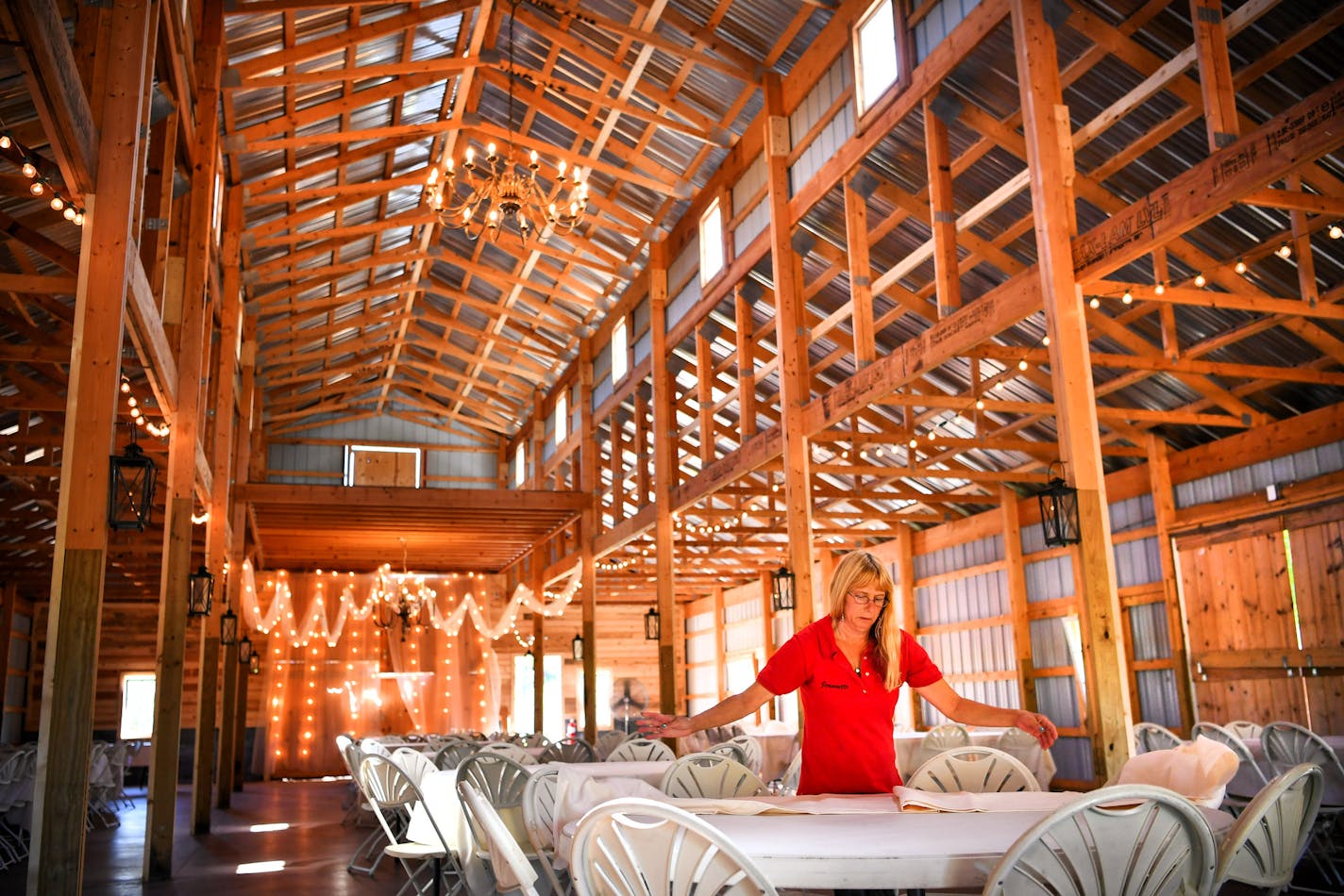 Jeanette Schnoor prepared the barn for a Friday wedding. ] GLEN STUBBE * gstubbe@startribune.com Thursday, September 1, 2016 Sponsel's Minnesota Harvest Apple Orchard, A popular apple orchard and wedding venue filed a federal lawsuit against Scott County, alleging that regulations could hurts its business. Susan Kelly, a member of the Sponsel family who speaks on behalf of the family trust, will be at the barn on Thursday at noon.