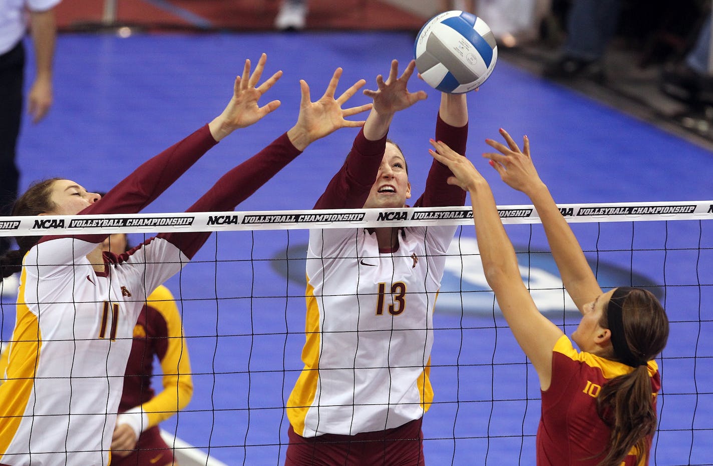 UM Gophers vs. Iowa State NCAA tournament volleyball. Minnesota's Ariana Filho (11) and Ashley Wittman (13) defended agasinst an Iowa State spike.