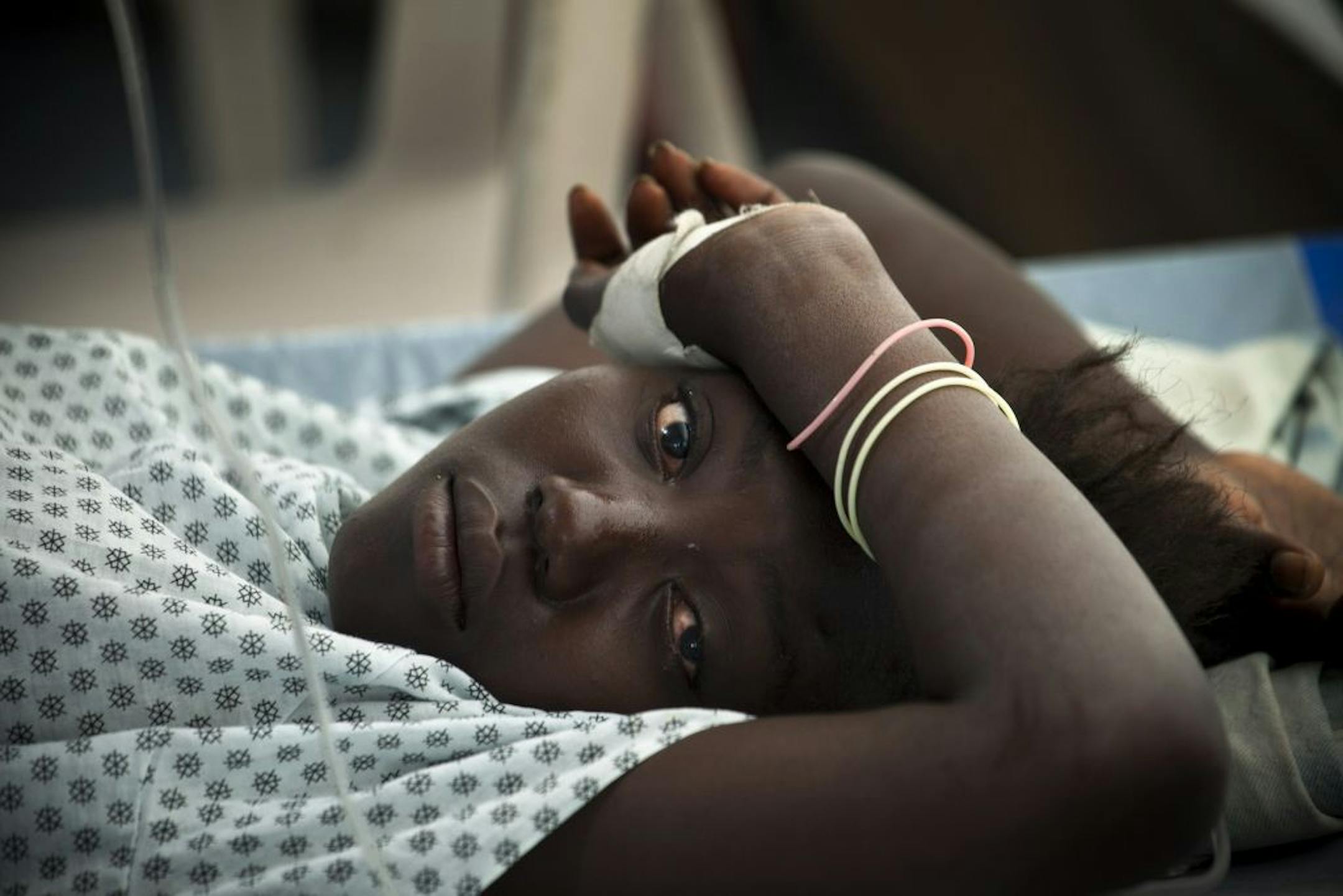 A cholera patient receives treatment at a Doctors Without Borders clinic center in Port-au-Prince, Haiti, Feb. 7, 2012. The world rallied to confront Haiti's cholera, but the mission was muddled by the United Nations' apparent role in setting off the epidemic and its unwillingness to acknowledge it.