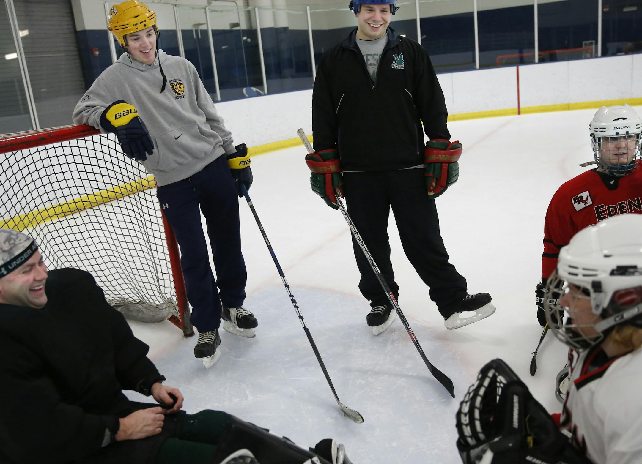 At a practice for the Minnesota Northern team at the Richfield Ice Arena, Duffy Fallon and head coach Chris Gustafson were in good humor as goalie Judd Yaeger, far left, kidded Rose Hollermann, right, about taking over as goalie. In red is Eric Rude. Fallon suffered severe concussions which cut his high school hockey career short at Breck.]rtsong-taatarii@startribune.com