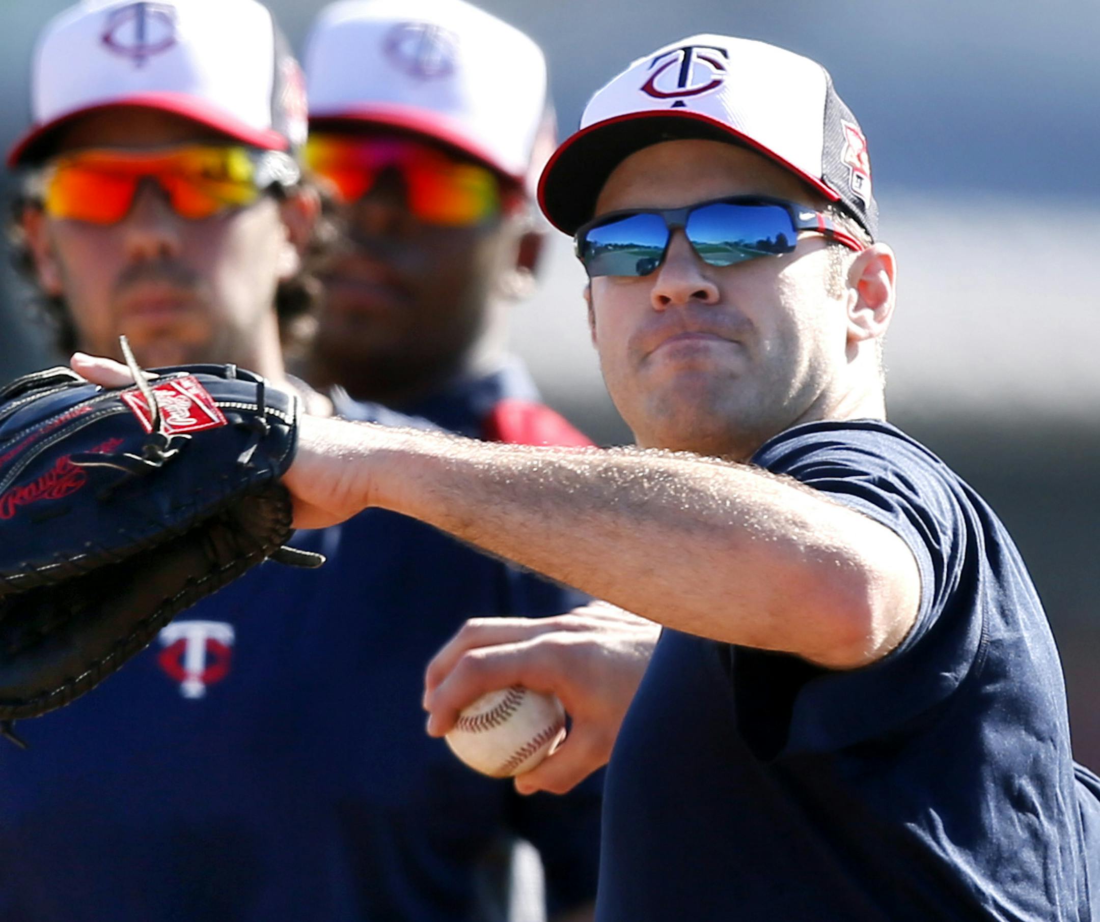 Twins Joe Mauer makes a throw to home plate during spring training practice Tuesday Feb 17. 2014 in Fort Myers, Florida Lee County Sports Complex.. ] JERRY HOLT jerry.holt@startribune.com