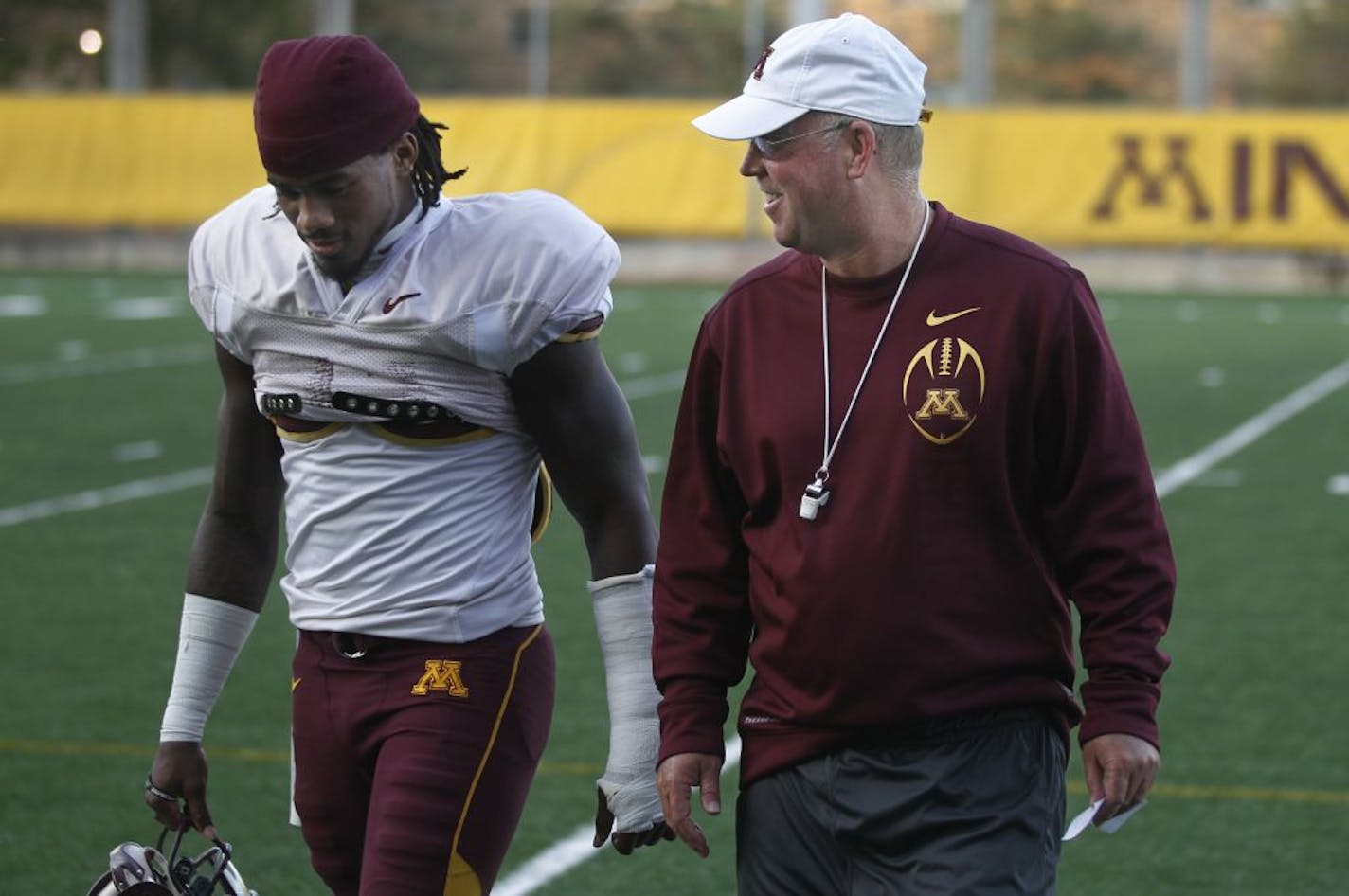 At the University of Minnesota Bierman Field on September 28th, head football coach Jerry Kill was back in the swing of things overseeing practice. Afterwards he walked off the field with Troy Stoudermire and addressed the media.