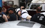 Ahmad Khan Rahami is taken into custody after a shootout with police Monday, Sept. 19, 2016, in Linden, N.J. Rahami was wanted for questioning in the 