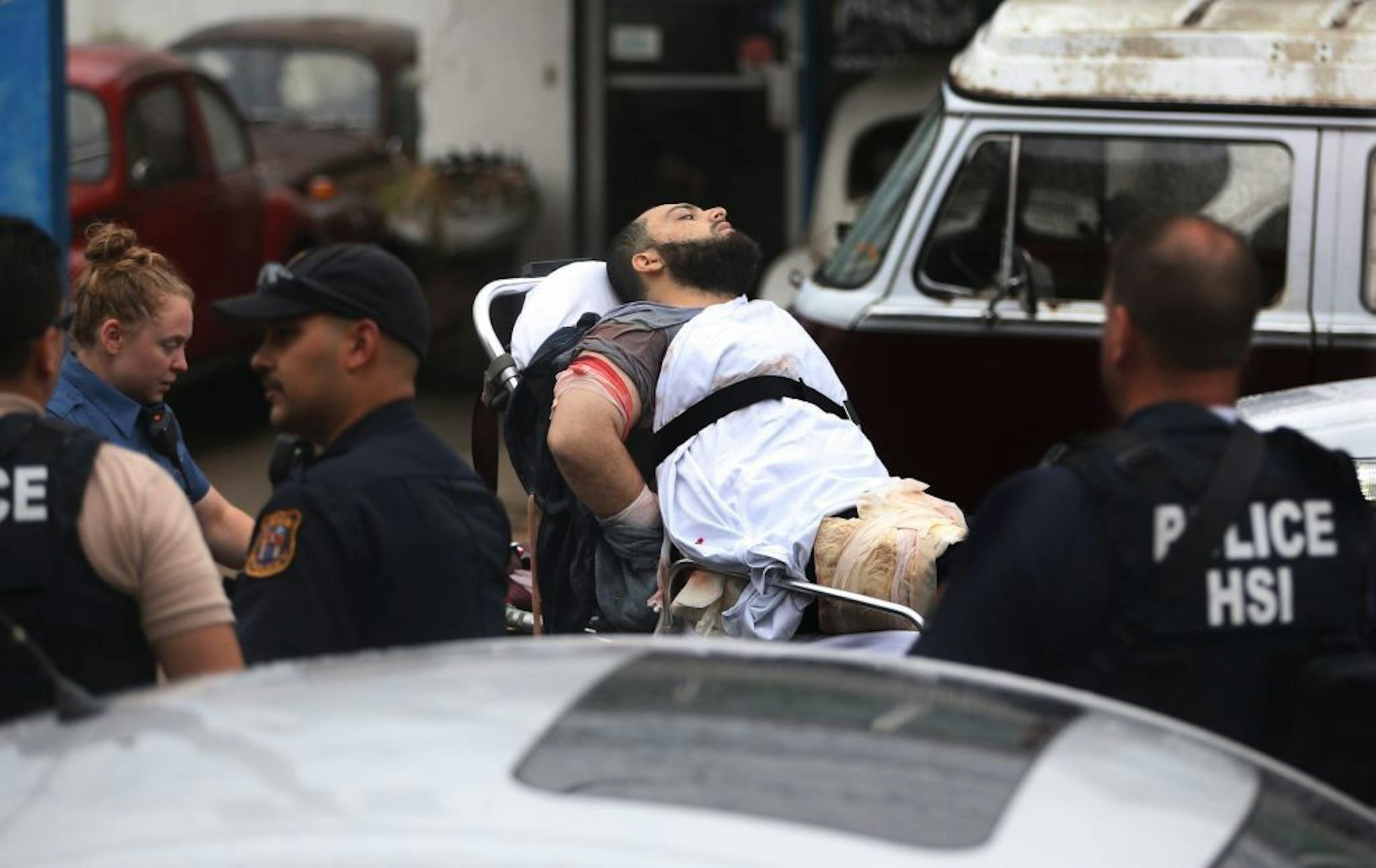 Ahmad Khan Rahami is taken into custody after a shootout with police Monday, Sept. 19, 2016, in Linden, N.J. Rahami was wanted for questioning in the bombings that rocked the Chelsea neighborhood of New York and the New Jersey shore town of Seaside Park.