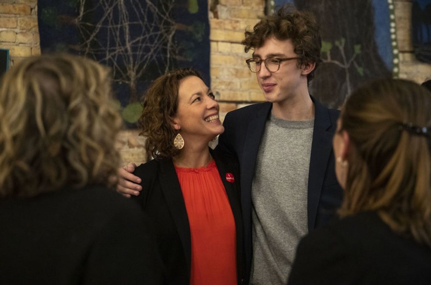 Duluth incumbent Mayor Emily Larson talked with her son, Eli Zaun, during her watch party at the Duluth Folk School on Tuesday night.