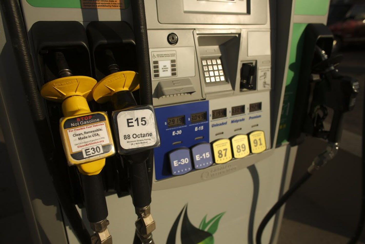 The higher-ethanol fuel blend called E15 has hit the Twin Cities through an unusual marriage between the state corn growers and independent gas stations. The first E15 pump opened this month at Rich Bohnen's station in south Minneapolis, under a new brand name Minnoco with new pumping equipment designed for E15 that was financed by the corn growers' trade group. The pumps dispensing ethanol blends are the two on the right; conventional gasoline comes from the pump on the right. Most cars built s