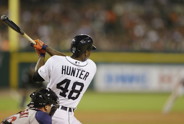 Detroit Tigers' Torii Hunter bats during the sixth inning of a baseball game against the Boston Red Sox in Detroit, Sunday, June 8, 2014. (AP Photo/Ca