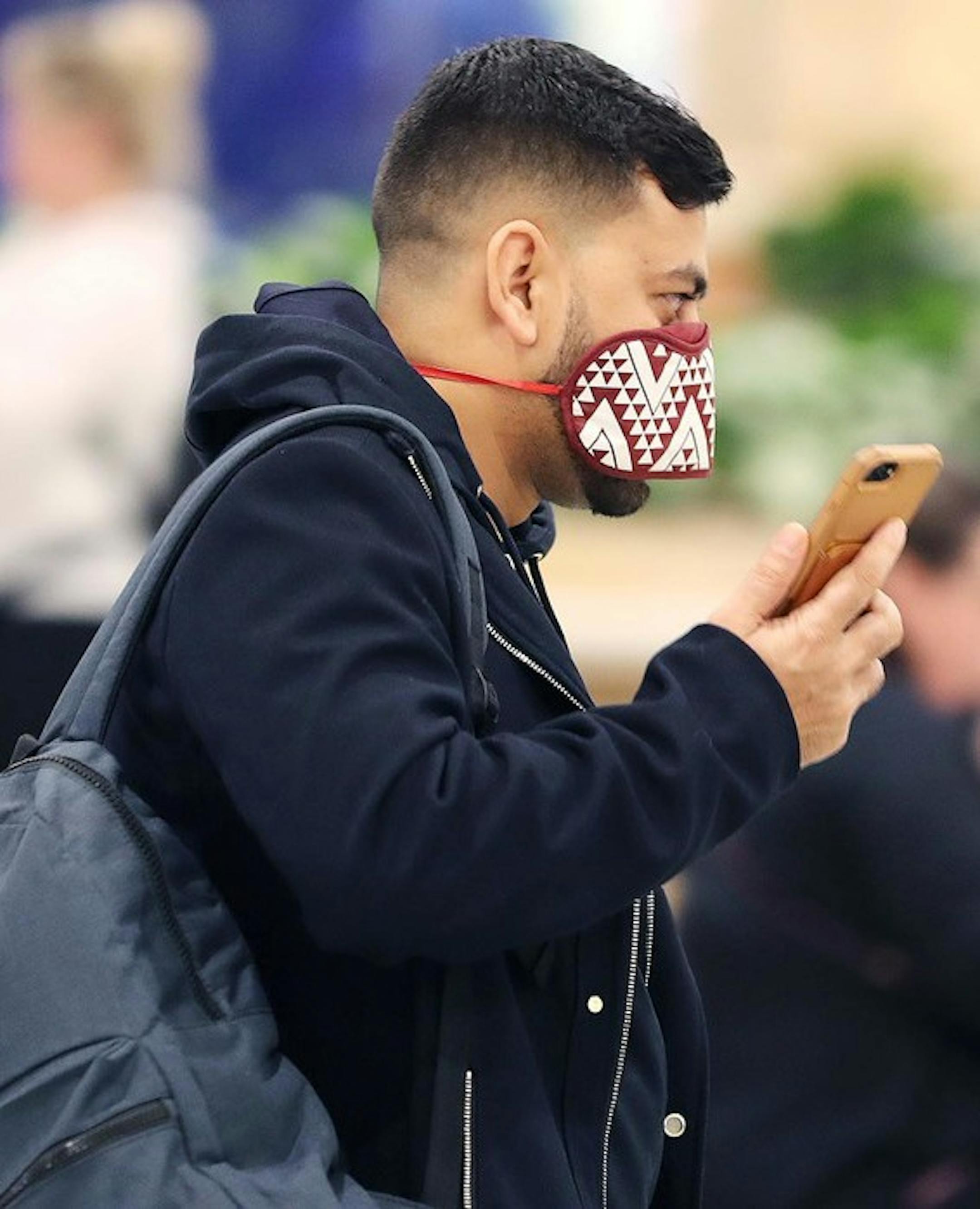 Airline passengers wear masks in the terminal area of Orlando International Airport on Wednesday, March 4, 2020. Many people are wearing masks in light of the Coronavirus outbreak. (Stephen M. Dowell/Orlando Sentinel/TNS) ORG XMIT: 1593749