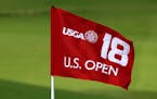 FILE - In this Sept. 30, 2014, file photo, the U.S. Open 18th hole flag is shown at Chambers Bay, the host course for the 2015 U.S. Open golf tourname
