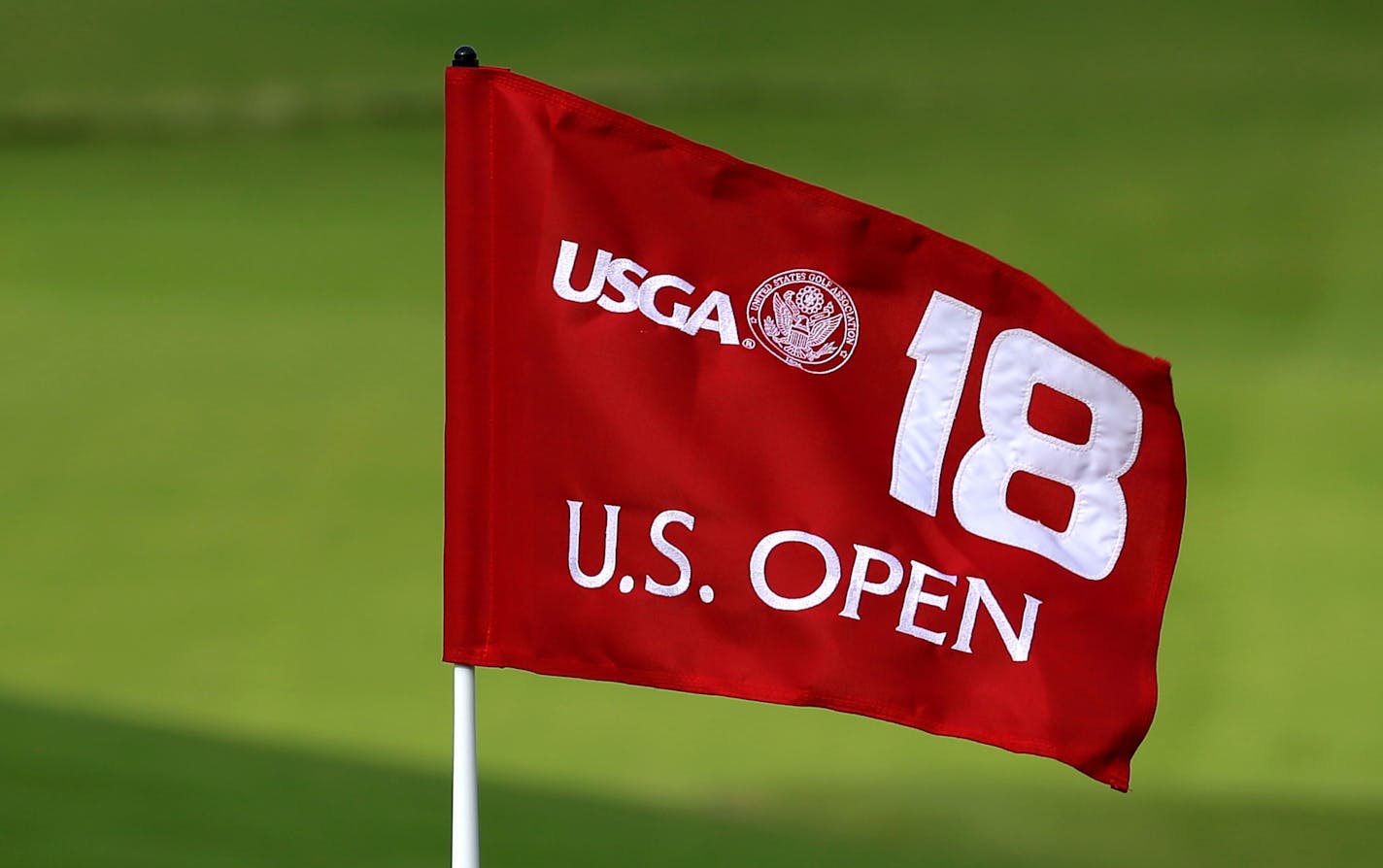 FILE - In this Sept. 30, 2014, file photo, the U.S. Open 18th hole flag is shown at Chambers Bay, the host course for the 2015 U.S. Open golf tournamen, in University Place, Wash. Chambers Bay will host the 115th U.S. Open golf tournament next week, but the course is a mystery to the majority of the players because it opened only eight years ago. (AP Photo/Ted S. Warren, file)