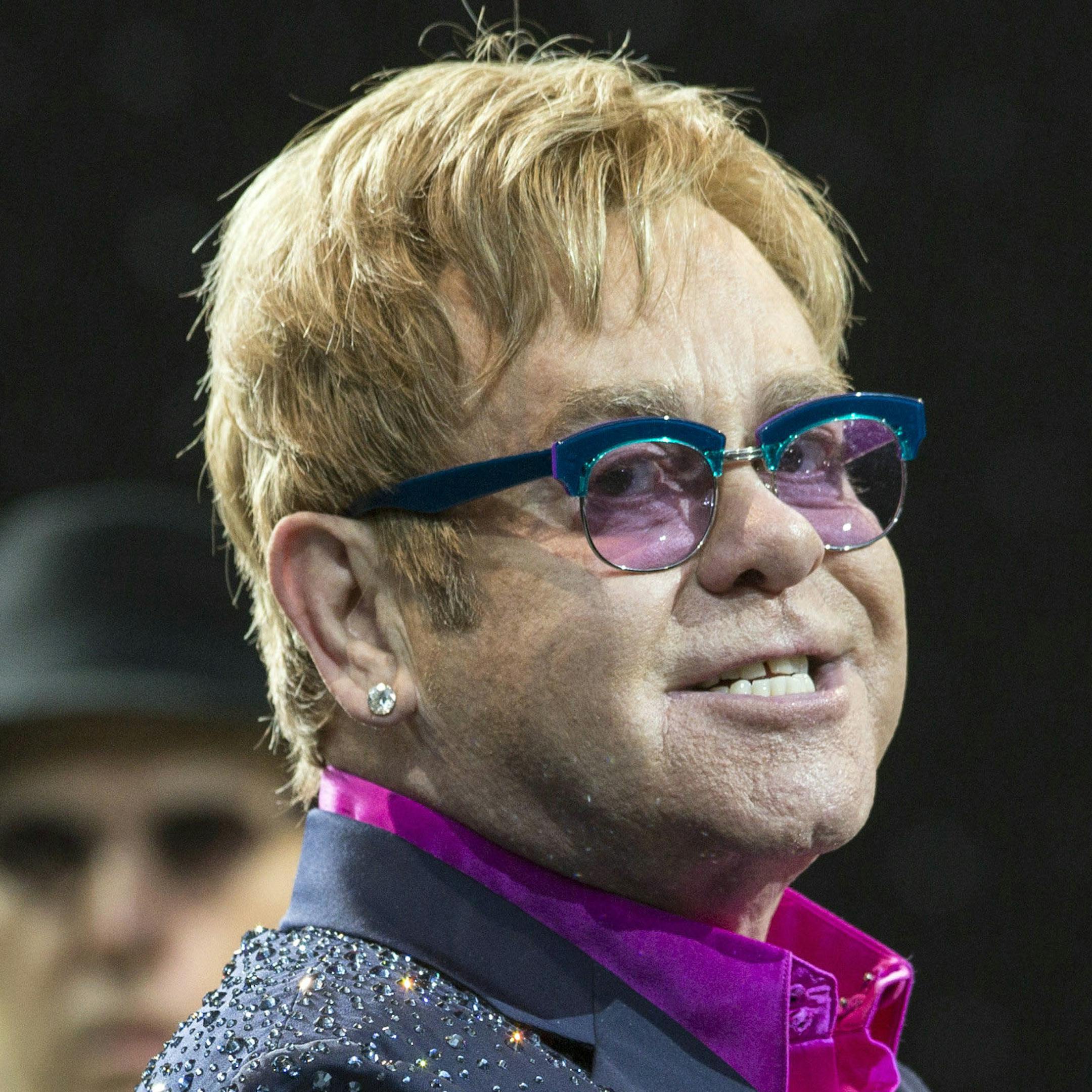 In this picture made available Friday, Sept. 6, 2013, Sir Elton John performs on the Waldbuehne stage in Berlin, Germany, Thursday, Sept. 5, 2013. British musician John gives five concerts in Germany during his 'Greatest Hits Live Tour 2013'. (AP Photo/dpa, Florian Schuh)