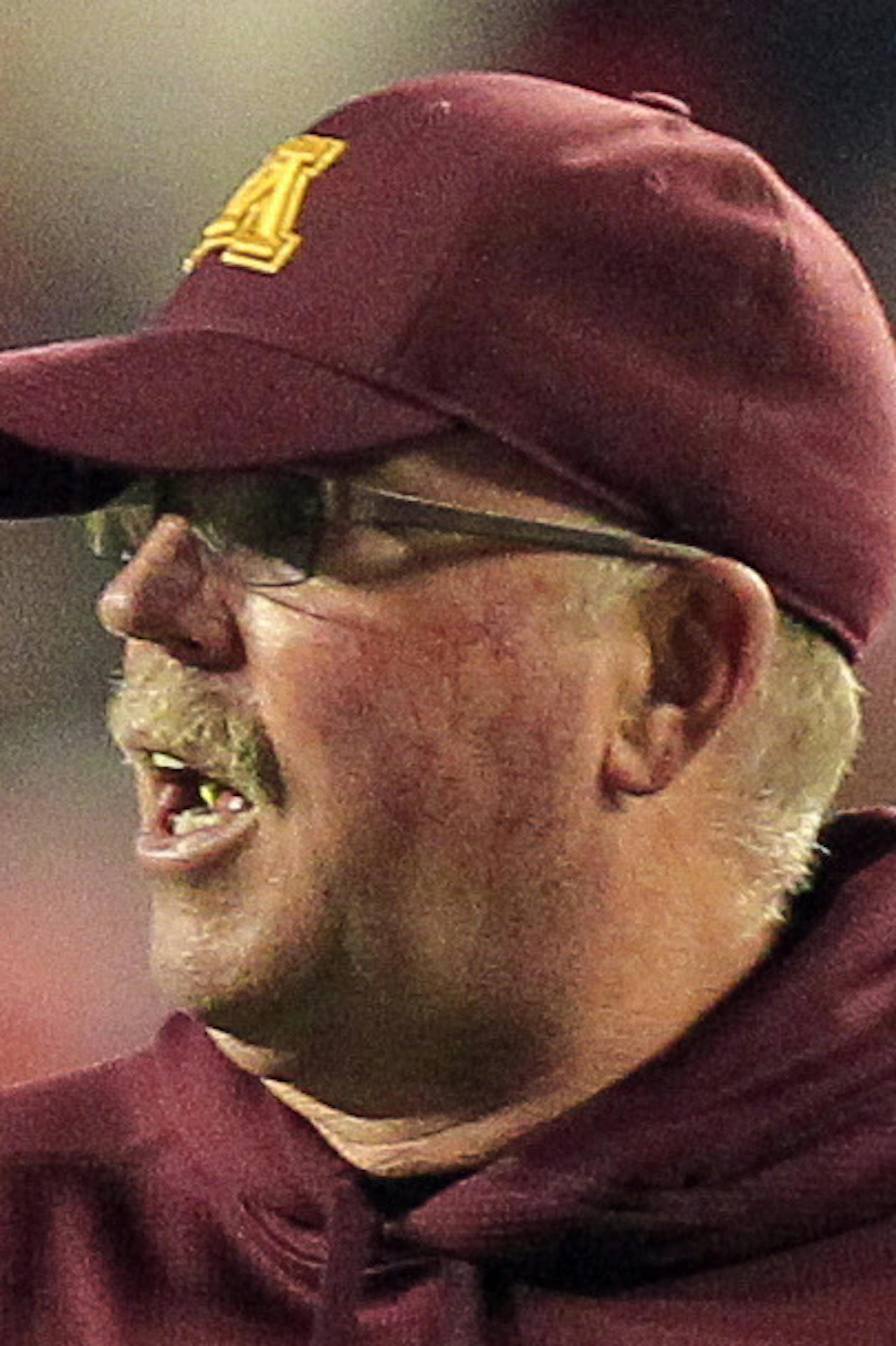 Minnesota coach Jerry Kill, center, yells at officials during the second half of an NCAA college football game against Wisconsin, Saturday, Nov. 29, 2014, in Madison, Wis. Wisconsin won 34-24. (AP Photo/Andy Manis)