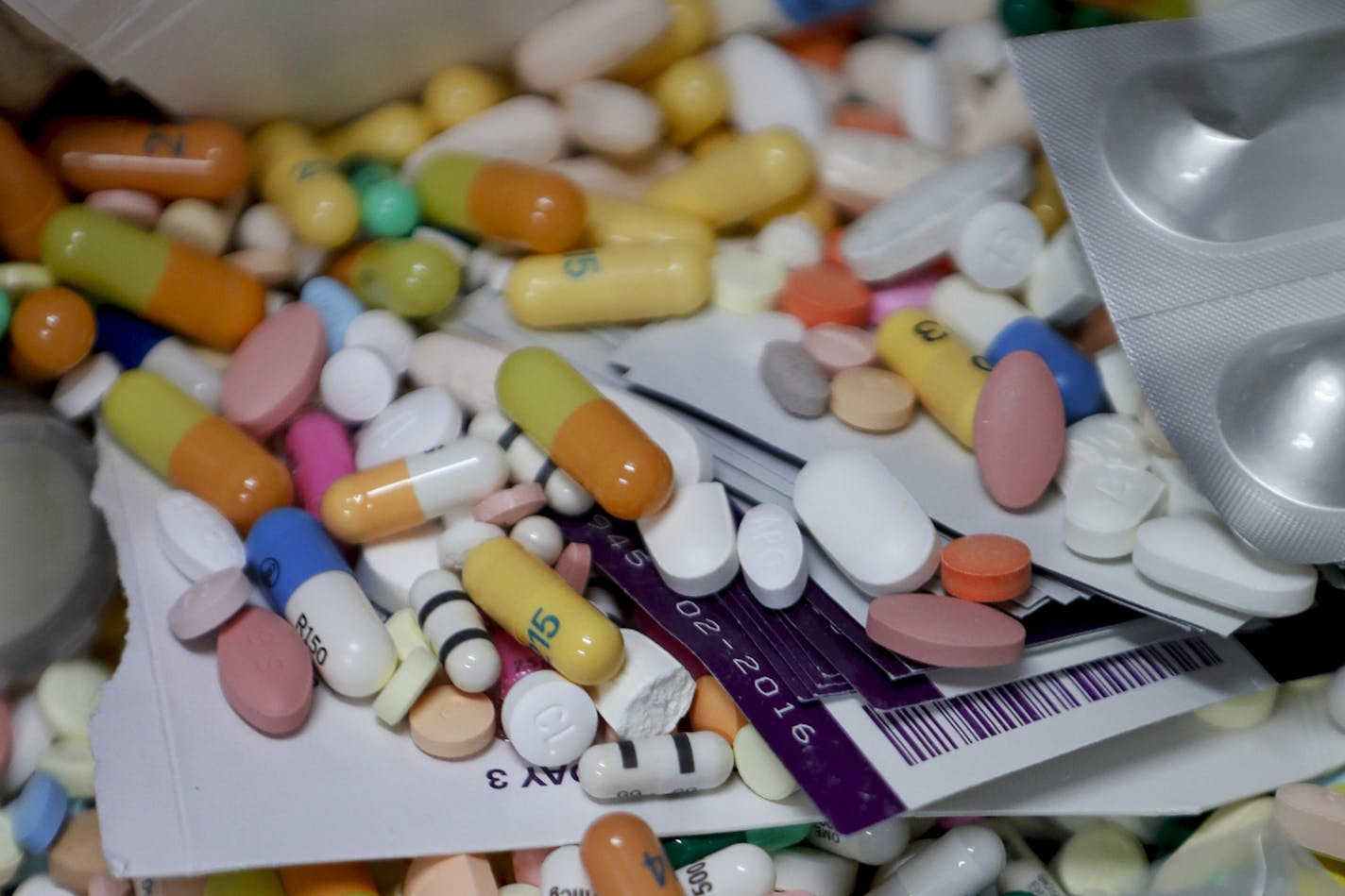 FILE&#x2014;This file photo from Sept. 11, 2019 shows medications in a locked storage area that are slated for destruction at the police headquarters in Barberton, Oh. The nation's three biggest drug distributors and a major drugmaker reached a $260 million settlement with two Ohio counties over the deadly havoc wreaked by opioids, just hours before the first federal trial over the crisis was about to begin Monday. (AP Photo/Keith Srakocic, File)