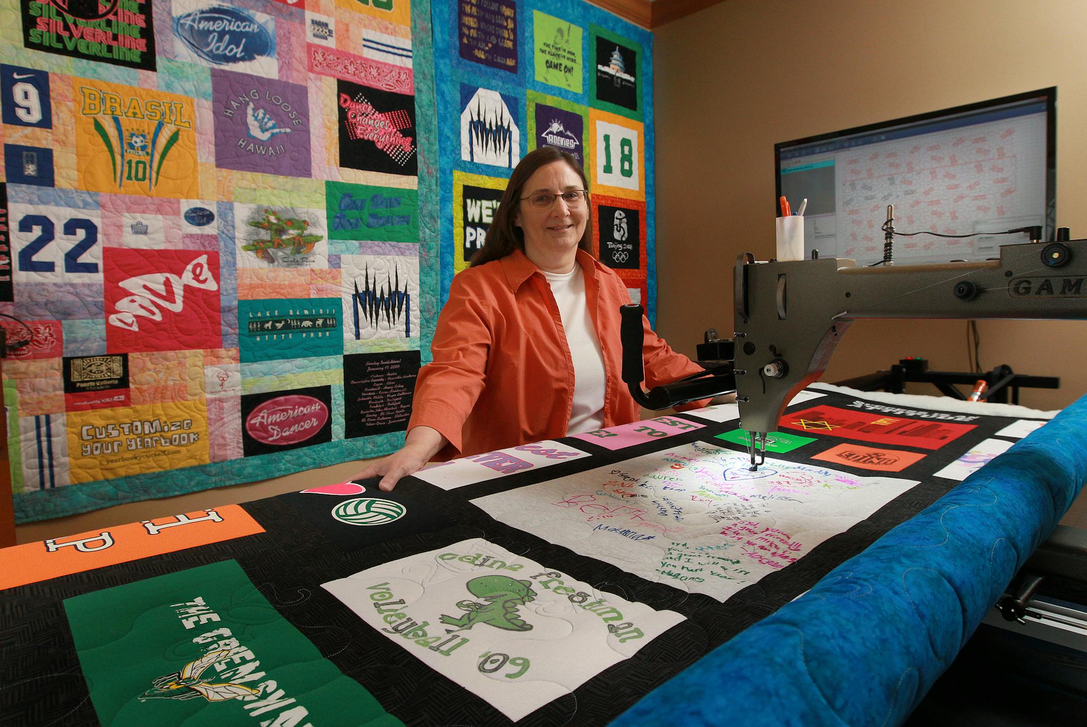 Beth Kobliska produces quilts made of t-shirts in her Inver Grove Heights Home. The final quilting is done on her 12 foot quilting machine the is programmed with a variety of stitching styles.