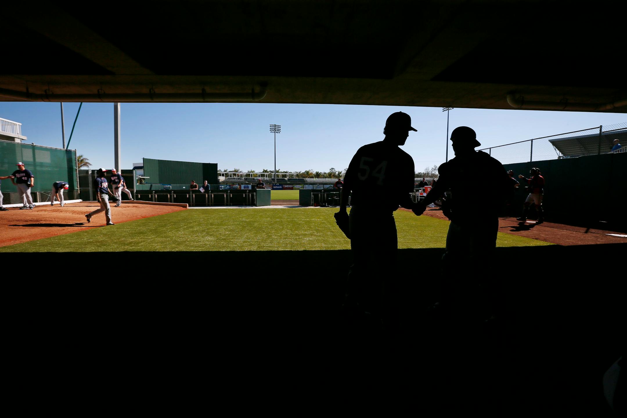 Matt Guerrier, left, shook hands with catcher Matt Koch after throwing in the bullpen Monday Feb 17, 2014 in Fort Myers, Florida at the Lee County Sports Complex.