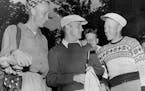 Bill Waryan, center, has a little chat with Les Bolstad, right, the University pro, while Don Holick, Waryan's caddy and a golfer himself, listens in 