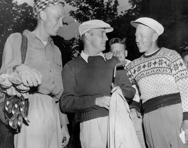 Bill Waryan, center, has a little chat with Les Bolstad, right, the University pro, while Don Holick, Waryan's caddy and a golfer himself, listens in 