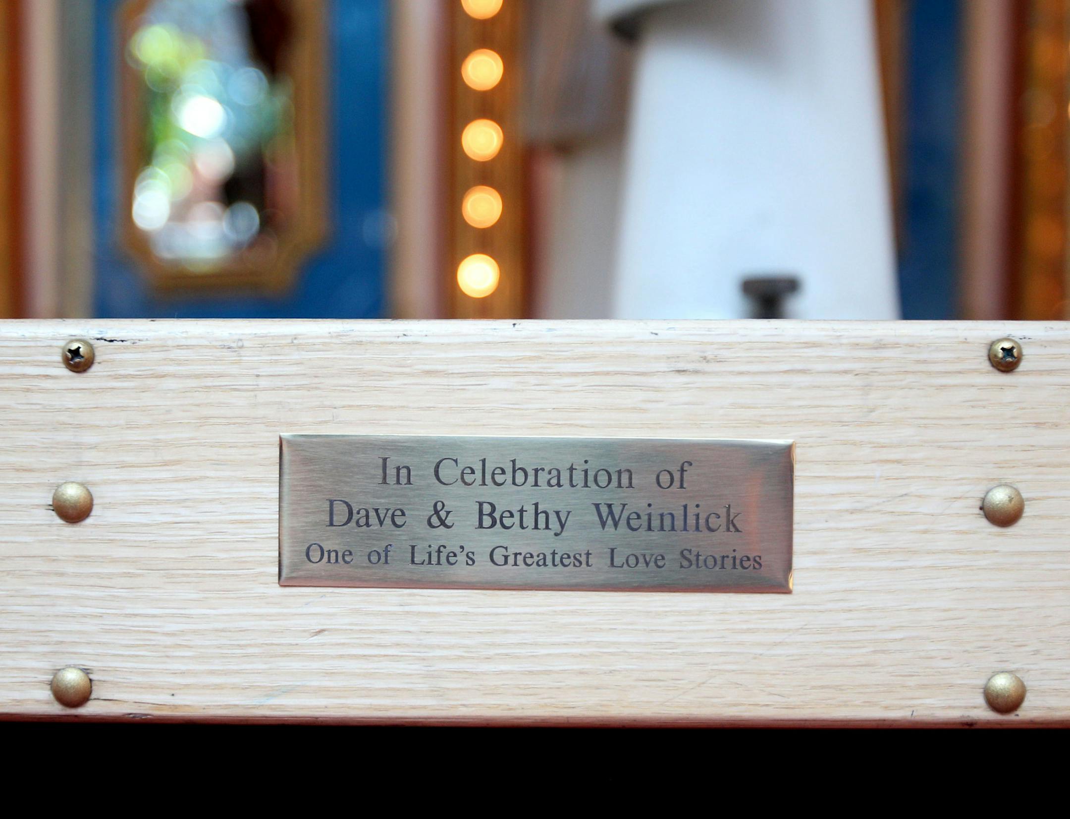 A plaque commemorating Elizabeth and David Weinlick was added to the base of the carousel in Mall of America on Wednesday. ] ALEX KORMANN &#x2022; alex.kormann@startribune.com Elizabeth "Betty" and David Weinlick loved carousels. When they got married twenty years ago, Elizabeth wanted nothing more than to ride the carousel in Mall of America to celebrate but she was unable to do to the design of her wedding dress. Nineteen years later, the couple renewed their vows and together they rode the ca