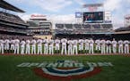The Twins stood for the National Anthem before the 2019 opener against Cleveland.