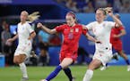 United States' Rose Lavelle, left, and England's Keira Walsh challenge for the ball during the Women's World Cup semifinal soccer match between Englan