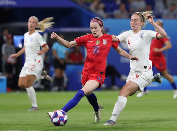 United States' Rose Lavelle, left, and England's Keira Walsh challenge for the ball during the Women's World Cup semifinal soccer match between Englan