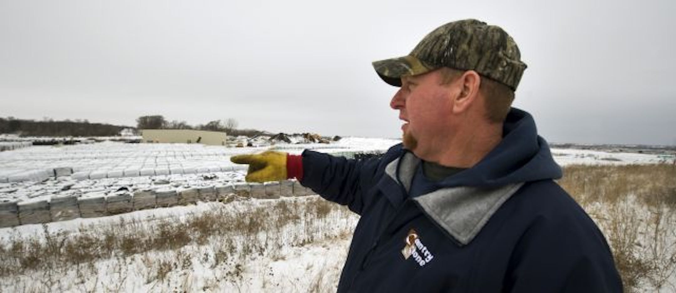 Lee Ledford, Country Stone plant manager, looked at the surrounding country last week from the top of a berm around the facility.