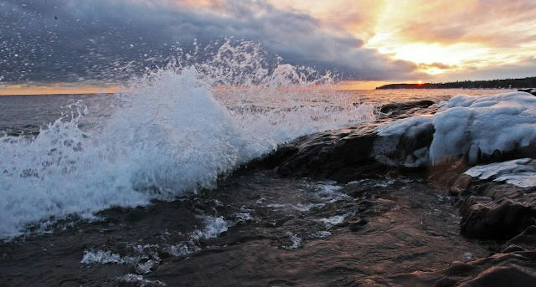 Winter scene along the north shore of Lake Superior at sunset.