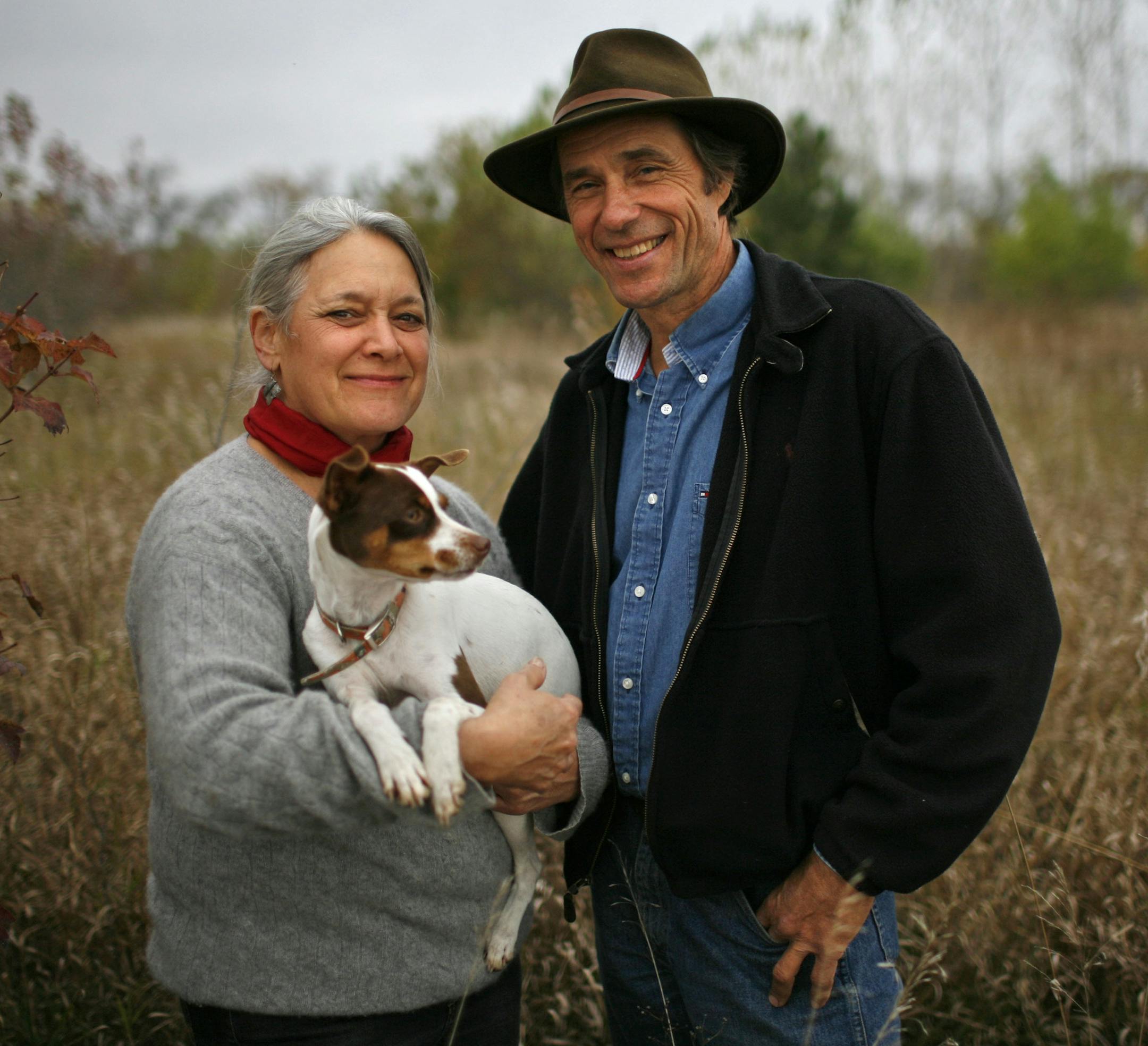 Audrey Arner, with husband Richard Handeen, holding Abby, on their farm, Moonstone Farm, near Montevideo, Mn, Saturday. Moonstone Farm is showing that productive ag land and prime wildlife habitat aren't mutually exclusive. The farm is an example of sustainable agriculture; there are no corn or beans fields, it's all pastures where grass-fed beef cattle roam. The benefits: less runoff, erosion and chemicals, and more wildlife habitat. A classic win-win. Officials say more of these farms on the l