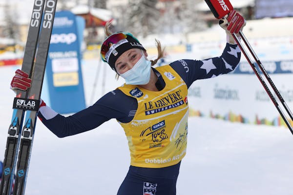 Jessie Diggins, of the USA, celebrates after winning a Tour de Ski, women's 10-kilometer freestyle, interval start cross-country ski event, in Dobbiac