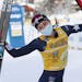Jessie Diggins, of the USA, celebrates after winning a Tour de Ski, women's 10-kilometer freestyle, interval start cross-country ski event, in Dobbiac