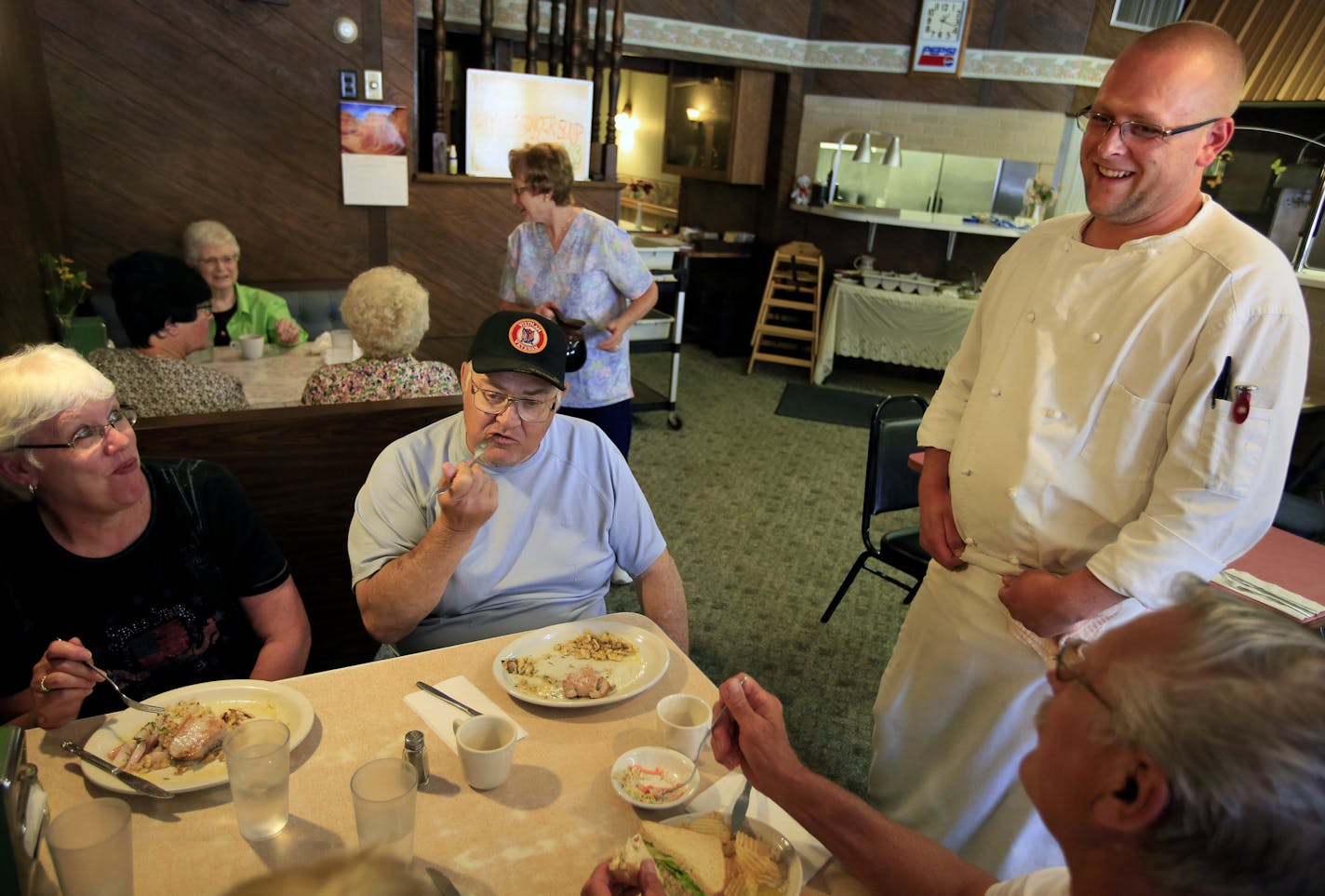 Chef Seth Lintelman, right, chatted with Cup N&#x2019; Saucer customers Peggy and Dave Custard of St. Paul (facing camera) and Gayla and Jim Miller of Fairmont during the lunch rush Friday.