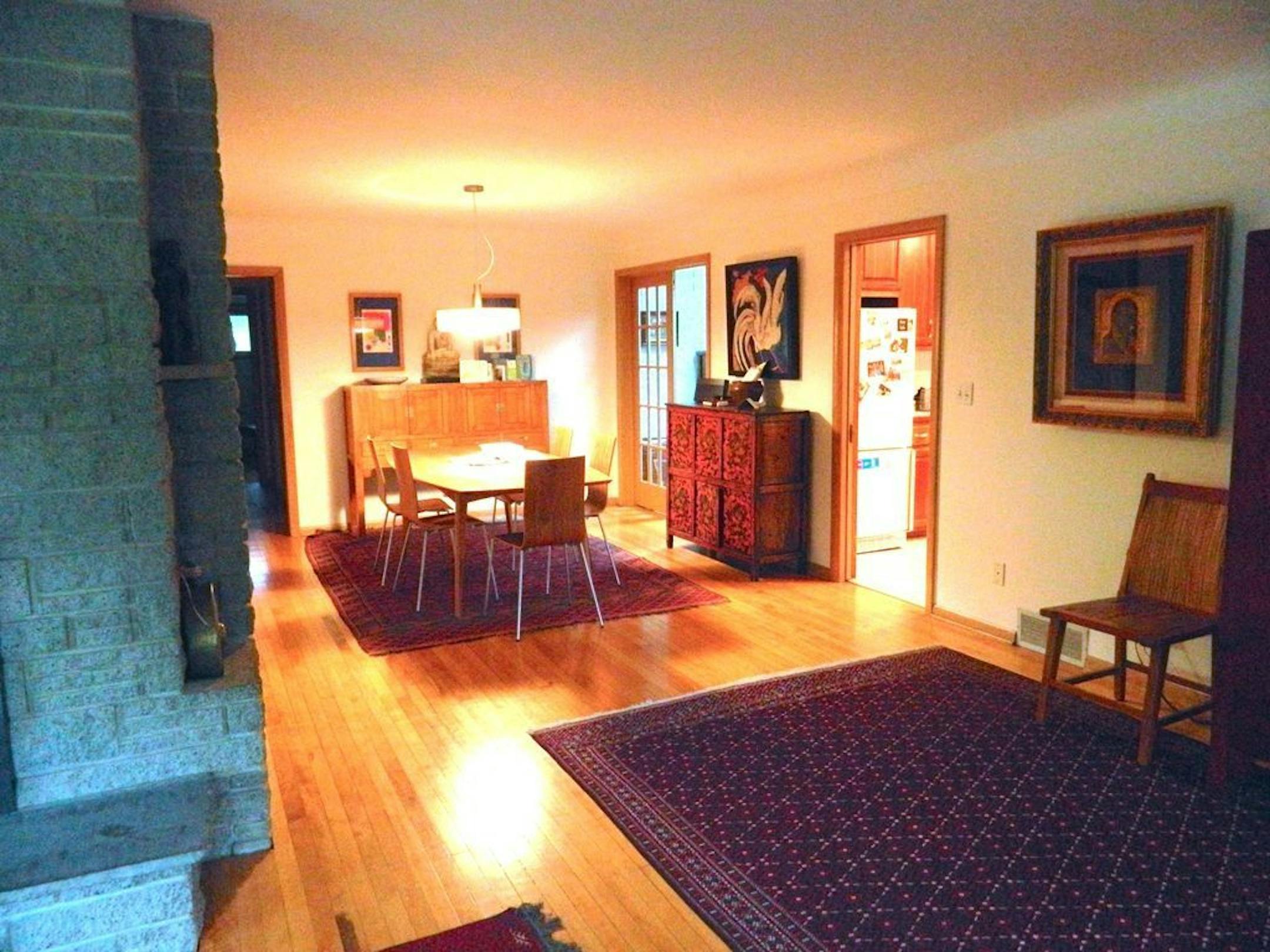 BEFORE A wall separated the living and kitchen areas.